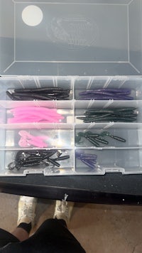 a box filled with a variety of fishing lures