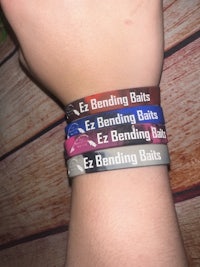 a person wearing a wristband with the words ebb ebb ebb ebb eb